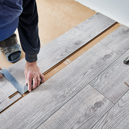 man working on flooring